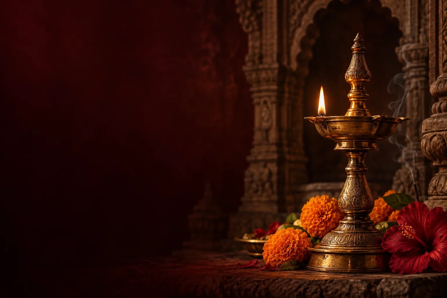 Devotional artwork of a glowing brass deepam with marigold and hibiscus offerings
